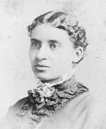 Black and white photo of Charlotte Forten Grimké from the shoulder up.