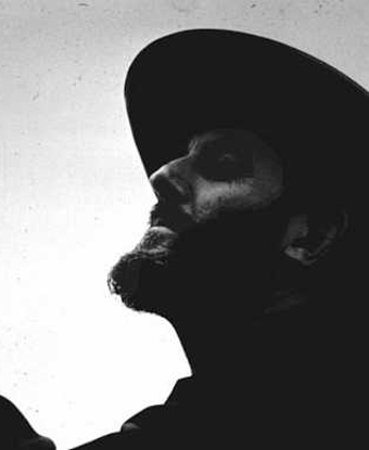 Black and white image of a bearded man's profile