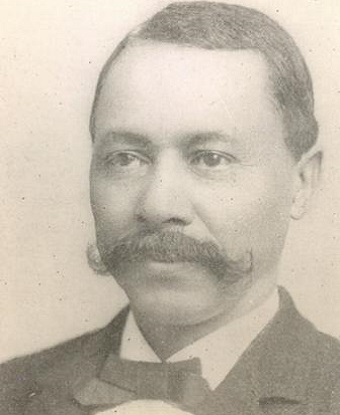 Man wearing a suit and bow tie
