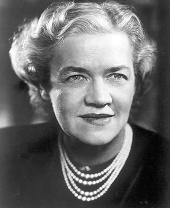 Portrait of Margaret Chase Smith. She is wearing a strand of pearls.