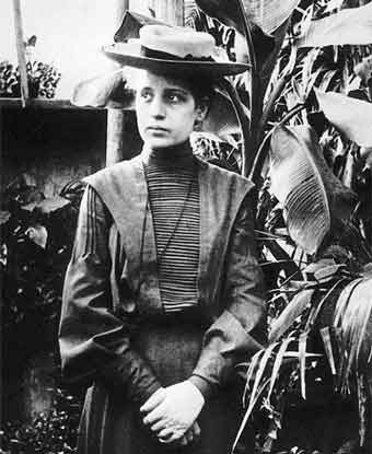 woman in 19th century clothing in front of banana tree woman in 19th century clothing in front of banana tree