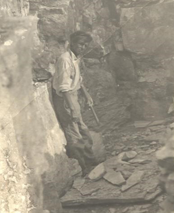 Joe Taylor leaning against his quarry wall