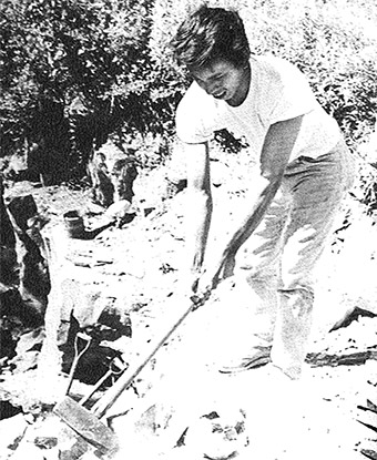 Jeff Derby swinging a sledgehammer