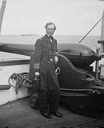 Rear Admiral John A. Dahlgren standing by a Dahlgren gun aboard the USS Pawnee