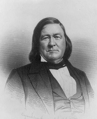 Half length black and white portrait of James L Petigru, seated