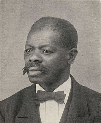 Studio portrait photograph of Jacob Stroyer in suit and tie