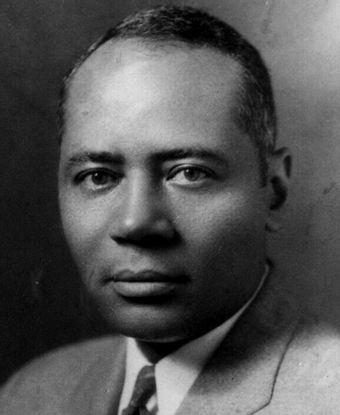 Charles Hamilton Houston sits in a light grey suit and neck tie
