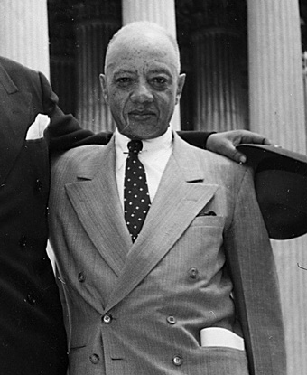 James Nabrit Jr stands on the steps of the U.S. Supreme Court