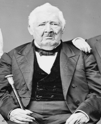 man in a suit posing for a portrait.