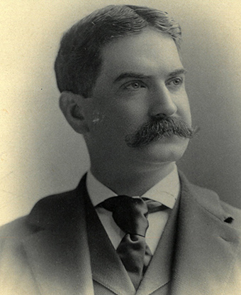 Black and white portrait showing head and shoulders of Moses Cone