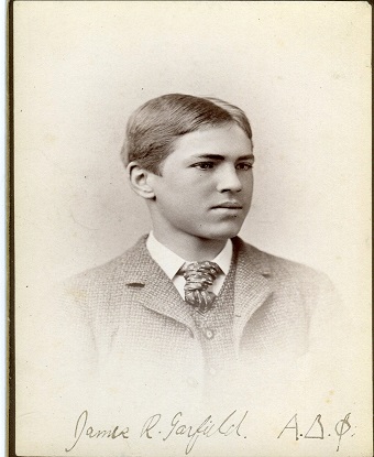 a black and white photo showing a young man 