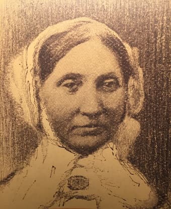woman in the 19th century wearing a bonnet.