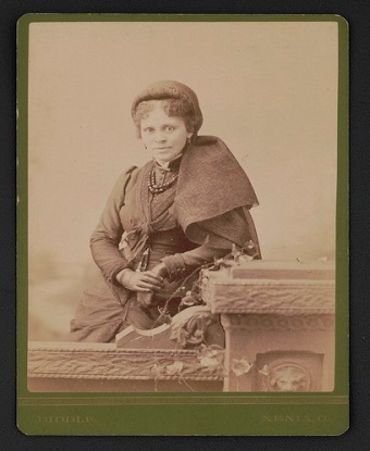 black woman sitting for photograph