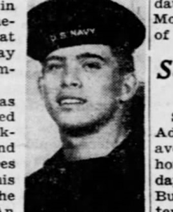 Black and white photograph portrait of a man in sailor's dress blues with a