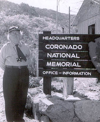 Grace Sparkes stands next to the Coronado National Memorial Headquarters sign. NPS photo