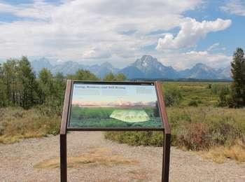 Wayside sign with view looking across Willow Flats toward Jackson Lake and the northern Teton Range