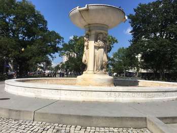 A circular granite fountain