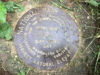 A plaque on the ground notes Fort Reno's elevation of 409 feet, making it the highest point in DC