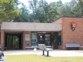 Brown brick building with the text, 