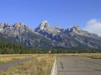 View of the Teton Range from the Windy Point Turnout. with the sagebrush flats leading to the logepole pine forest to the the peaks.