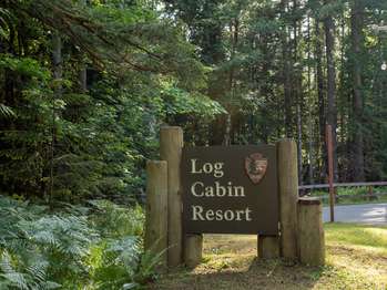 A sign with the National Park Service arrowhead logo and the words 