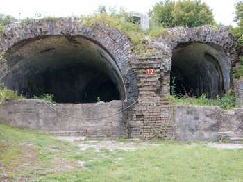 Two brick fort tunnels. A brown metal sign with the number,