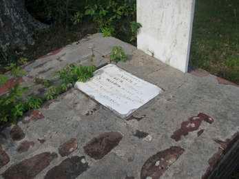 Brick, cement, and stone gravesite of Maggie Dough