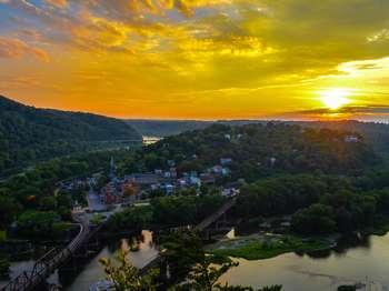 view of Harpers Ferry from Maryland Heights; at sunset, in the late summer