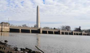 Kutz Bridge crosses over the water with the Washington Monument behind.