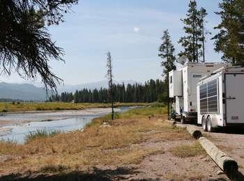 Trailers at campsite on Grassy Lake Road with Snake River in background