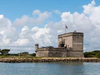 the riverĀ with Fort Matanzas National monumentĀ and a blue and cloudy sky