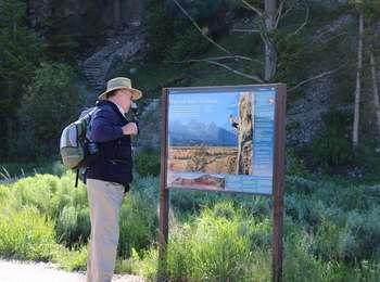 Blacktail Butte Trailhead with visitor reading sign.