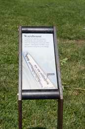 Wayside in front of grass.