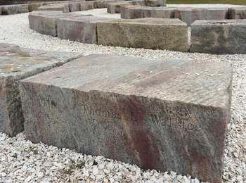 Close-up view of the old foundation stones with the keepers' names engraved in the stones.