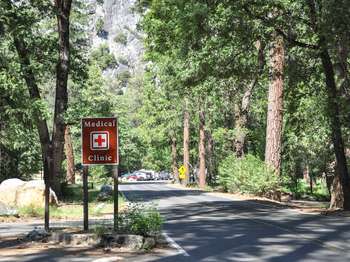 A roadside sign reads, 