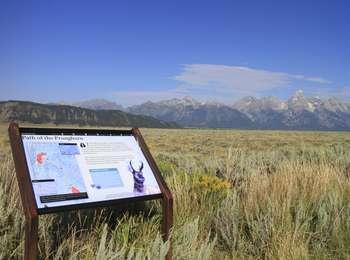 Path of the pronghorn wayside with view looking across sagebrush meadows of Anetlope Flats toward Blacktail Butte and the Teton Range
