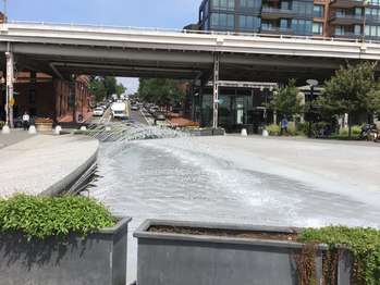 A spraying fountain on a plaza in Georgetown
