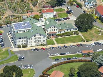 An overhead view of Fort Mason's headquarters, with the community garden behind. 