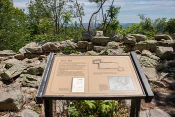 Close-up of wayside in front of old stone Civil War fort.