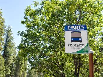 A blue and white sign reads,