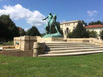 A turquoise copper statue of General Phillip Sheridan on a horse