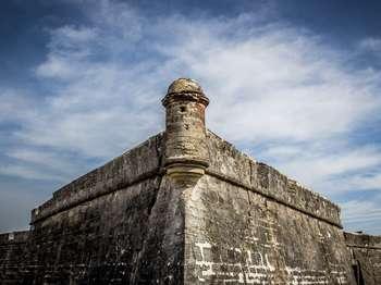 The southwest bastion of Castillo de San Marcos with a cloudy sky background