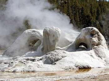 Steam emerges from travertine arches