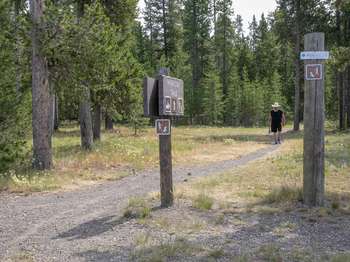 A lone hiker finishing his walk along the trail.