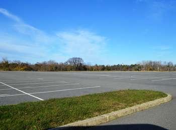 This empty lot will be filled with hundreds of cars during the peak of the summer season.