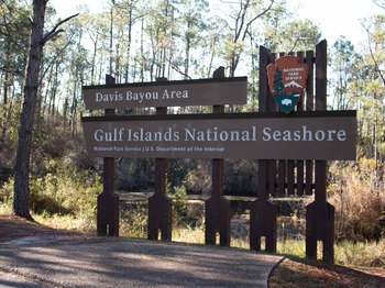 Large brown National Park Service sign with white text that reads, 