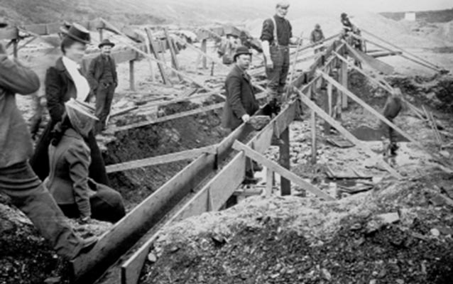 Historic photo of people sifting for gold on the beach at Nome, Alaska Historic photo of people sifting for gold on the beach at Nome, Alaska