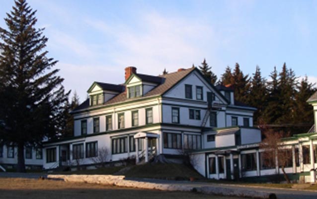 Historic white building with green trim Historic white building with green trim