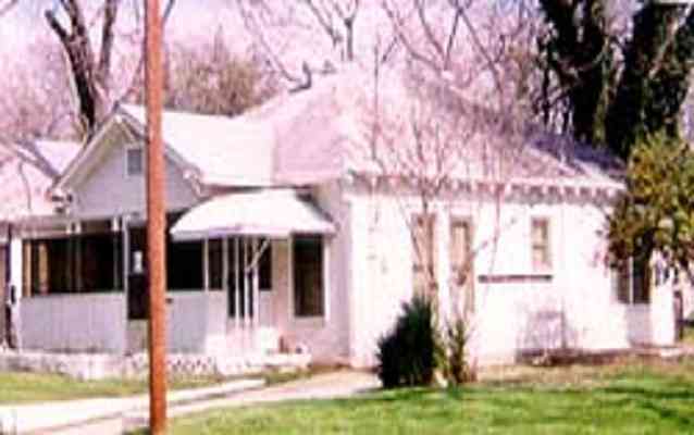 Exterior of a small, single story house. Exterior of a small, single story house.