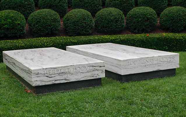A president's and first lady's graves are marked with two white marble slabs. A president's and first lady's graves are marked with two white marble slabs.